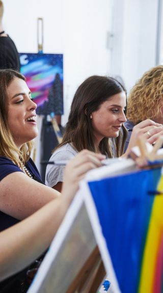 Attendees enjoying a painting class at Pinot & Picasso in Penrith, Sydney