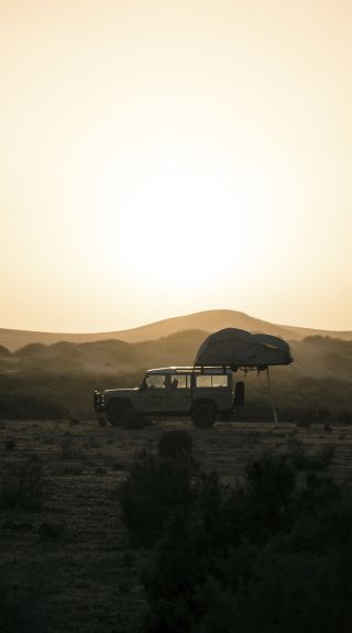 4WD setting up camp overlooking the sand dunes near Mungo National Park