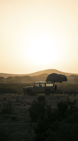 4WD setting up camp overlooking the sand dunes near Mungo National Park