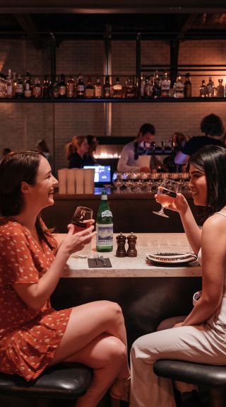 Friends enjoying food and drink at Parry Street Garage, Newcastle West