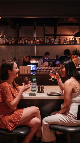 Friends enjoying food and drink at Parry Street Garage, Newcastle West