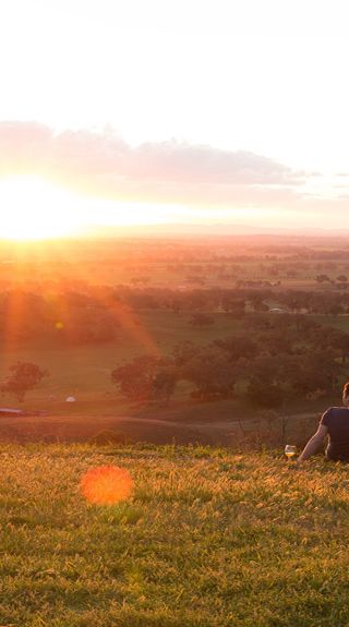 Couple enjoying a glass of wine at sunset, Tamworth
