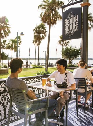 Friends enjoying afternoon drinks at The Beach House Restaurant and Bar in Port Macquarie, North Coast