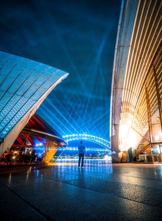 Man watching the City sparkle light projection and installation on the Sydney Harbour Bridge