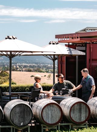 Couple enjoying outdoor wine tasting at First Ridge Wines, Mudgee