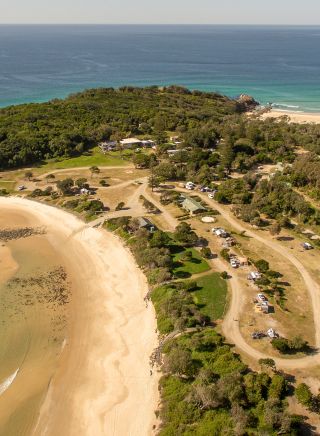 Aerial view of Point Plomer campground in Limeburners Creek National Park, Port Macquarie