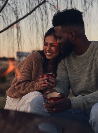 Couple enjoying campfire at Wilga Station, Evans Plains