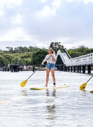 Couple enjoying a stand up paddleboarding experience with SWR SUP along Back Creek, South West Rocks