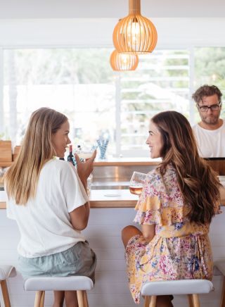 Women enjoying drinks, Avoca Surf House, Avoca Beach, Central Coast