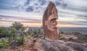 The sun sets over a large stone sculpture at the Living Desert Reserve, Broken Hill