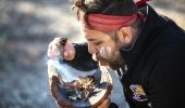 Aboriginal guide Dwayne Bannon-Harrison performing a smoking ceremony during a traditional welcome on a Ngaran Ngaran Culture Awareness tour, Ngaran Ngaran Culture Awareness, Narooma, South Coast