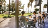 Friends enjoying afternoon drinks at The Beach House Restaurant and Bar in Port Macquarie, North Coast