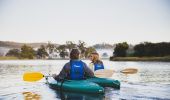 Couple enjoying a tour with Bellingen Canoe Adventures along the Bellingen River in Fernmount