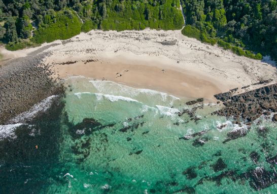 Coastal aerial of Pebbly Beach in Forster, North Coast