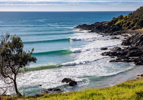  A lone surfer enjoys perfect waves at Crescent Head on the northern side of Racecourse Head.